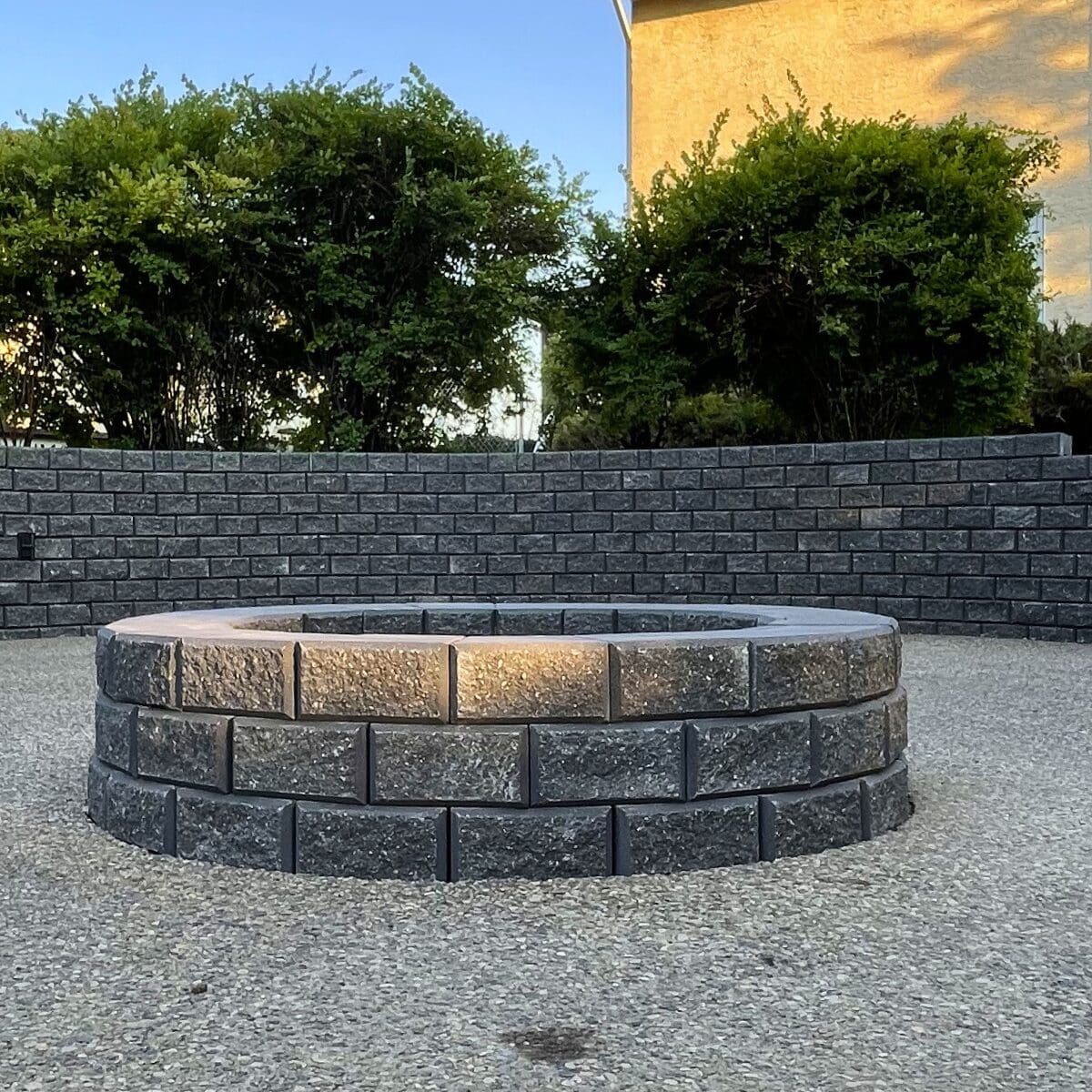 Backyard retaining wall creating flat usable yard space.